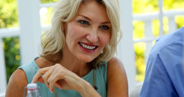 Smiling Mature Woman Enjoying Conversation Outdoors - Download Free Stock Images Pikwizard.com