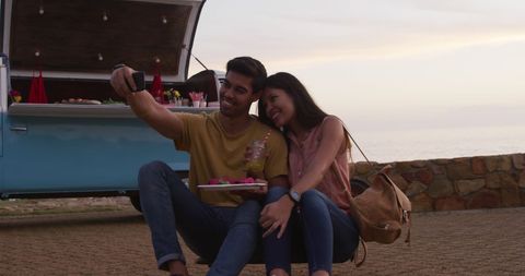 Happy Couple Taking Selfie at Sunset by Food Truck - Download Free Stock Images Pikwizard.com