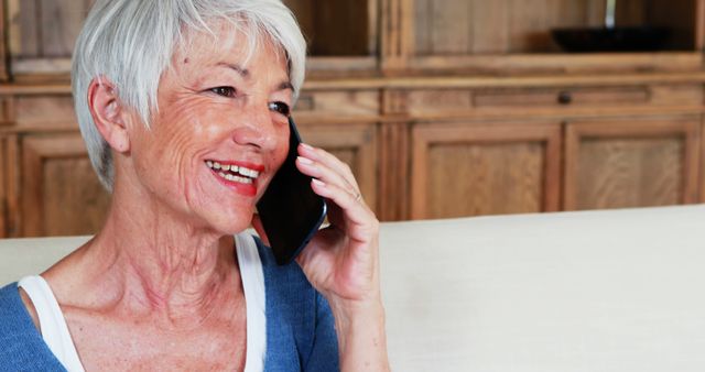 Happy Senior Woman Talking on Phone at Home - Download Free Stock Images Pikwizard.com