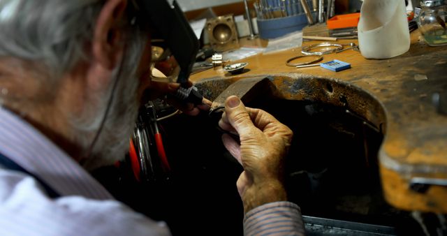 Craftsman Shaping Jewelry at Workbench Close-up - Download Free Stock Images Pikwizard.com