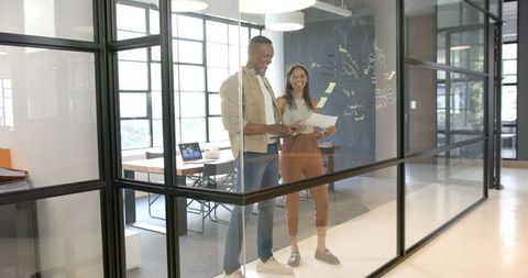 Collaborating Colleagues in Modern Office Meeting Room