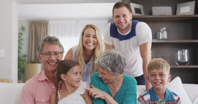 Multi-Generational Family Smiling in Living Room - Download Free Stock Images Pikwizard.com