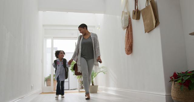 Happy african american mother and daughter entering house - Download Free Stock Photos Pikwizard.com