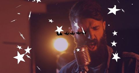 Festive Night: Denim-Clad Singer on Stage with Holiday Flair