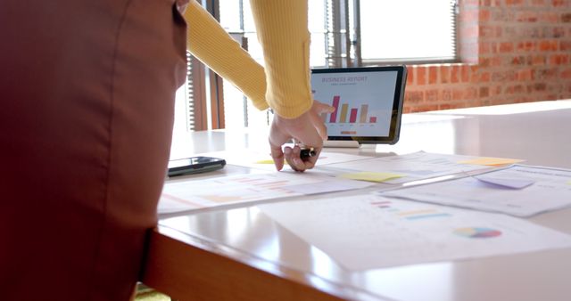 Person Analyzing Business Charts on Tablet at Office Desk - Download Free Stock Images Pikwizard.com