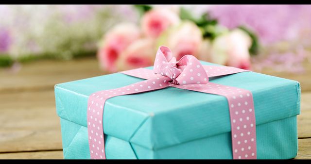 Beautifully Wrapped Gift Box With Pink Ribbon In Floral Background - Download Free Stock Images Pikwizard.com