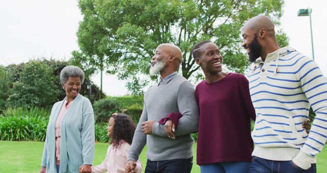 Multigenerational Family Enjoying Walk in Park - Download Free Stock Images Pikwizard.com