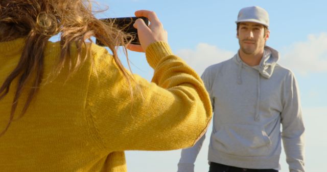 Woman Taking Photo of Man in Casual Clothing Outdoors - Download Free Stock Images Pikwizard.com