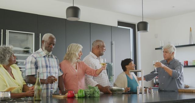 Senior Friends Enjoying Casual Gathering in Modern Kitchen - Download Free Stock Images Pikwizard.com