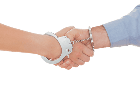 handcuffed handshake symbolizing commitment and restriction on transparent background - Download Free Stock Videos Pikwizard.com
