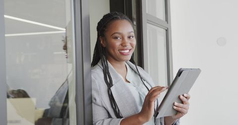 Confident African American Woman Using Tablet in Modern Office - Download Free Stock Images Pikwizard.com