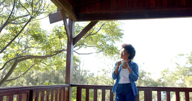 Woman Relaxing on Balcony with Coffee on Sunny Morning - Download Free Stock Images Pikwizard.com