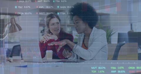 Diverse Businesswomen Analyzing Financial Data with Digital Overlay