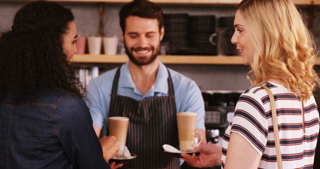 Barista Serving Coffee to Smiling Women at Cafe - Download Free Stock Images Pikwizard.com