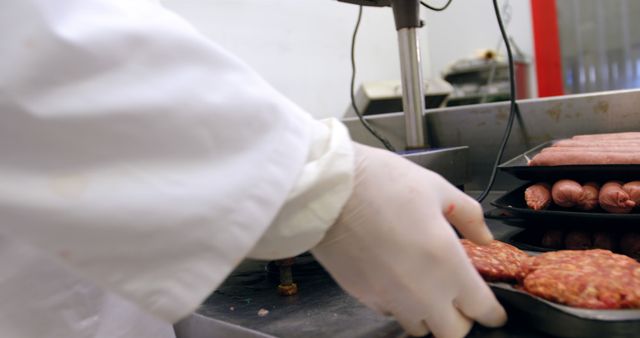 Butcher Handling Minced Meat and Sausage Trays - Download Free Stock Images Pikwizard.com