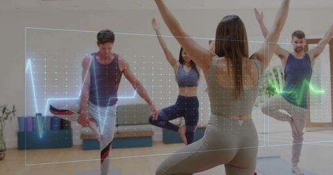 Yoga instructor leading group in tree pose wearing olive-green activewear with health overlay