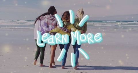 Four women embracing on beach with learn more overlay