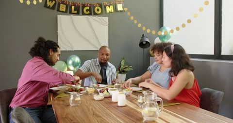 Diverse Group Celebrating at Housewarming Party Indoors