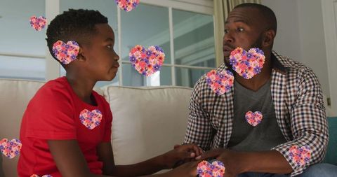 African american father having meaningful conversation with son