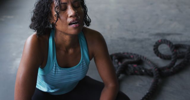 Tired Woman Resting After Intense Workout at Gym - Download Free Stock Images Pikwizard.com