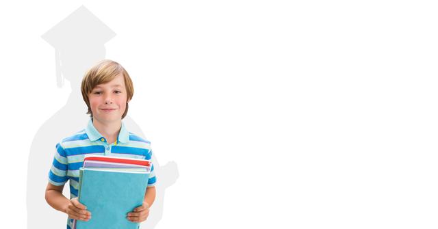 Happy boy holding books and smiling with a graduation silhouette in the background, representing aspirations and goals. Ideal for educational materials, school websites, and motivational content highlighting the importance of education and dreaming big.