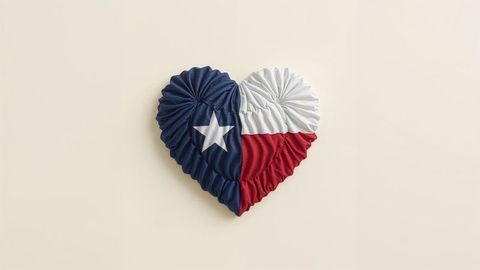 Heart-shaped texas flag textile on neutral background