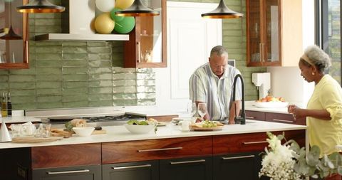 Happy Senior Couple Enjoying Quality Time in Modern Kitchen
