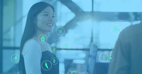 Businesswoman Integrating Sustainable Technologies in Modern Office