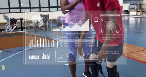 Trainer guiding athlete with prosthetic leg during adaptive fitness session with hud data