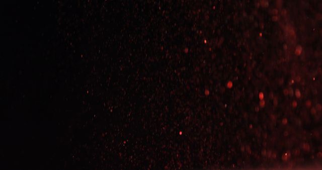 Red particles are scattered in a dynamic, dark background, with copy space - Download Free Stock Photos Pikwizard.com