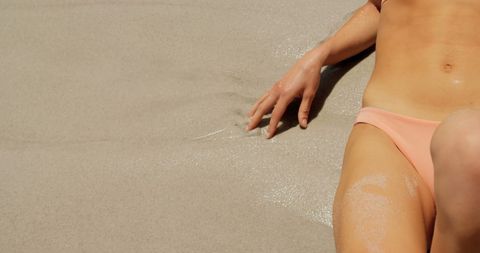 Relaxed Woman Enjoying Sunlight on Sandy Beach - Download Free Stock Images Pikwizard.com