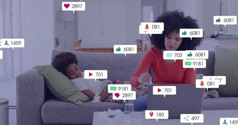 Working Mother Engaged in Home Office beside Resting Child on Sofa