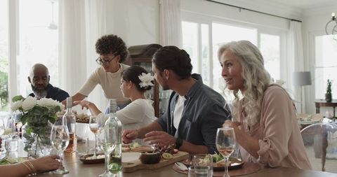 Friends enjoying lunch together around a dining table