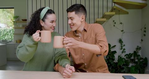 Cozy Couple Enjoying Morning Coffee Together in Modern Kitchen