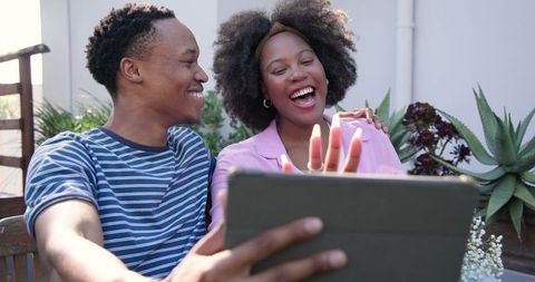 Happy Couple Taking Selfie with Tablet Outdoors