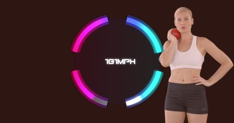 Female Athlete Holding Shotput Ball with Digital Speedometer Interface