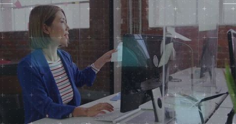 Professional Asian Woman Collaborating in Modern Office Setting