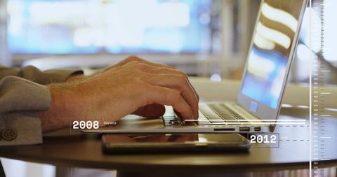 Caucasian Businessman Using Laptop with Financial Data Overlay - Download Free Stock Images Pikwizard.com