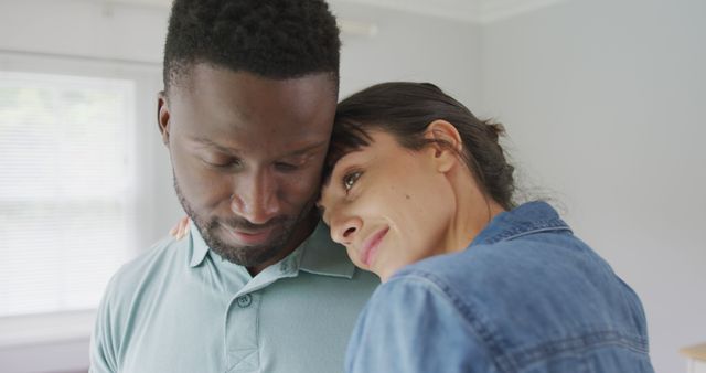 Interracial Couple Embracing and Sharing an Intimate Moment - Download Free Stock Images Pikwizard.com