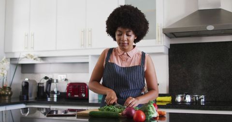 Woman Preparing Vegetables for Healthy Cooking in Modern Kitchen
