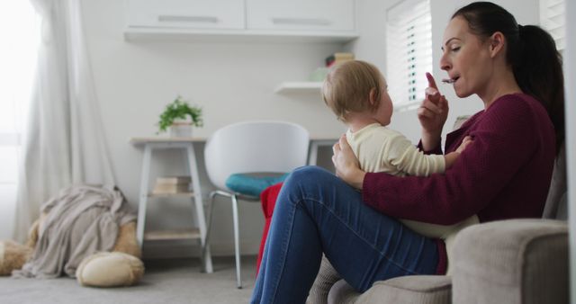 Mother Teaching Infant at Home, Nurturing Early Communication - Download Free Stock Images Pikwizard.com