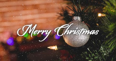 Snow falling with merry christmas text and ornaments