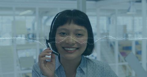 Businesswoman Managing Financial Data Using Headset, Office Environment