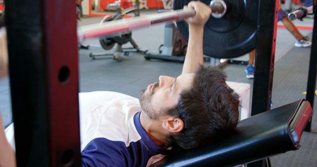 Young Man Bench Pressing at Gym - Download Free Stock Images Pikwizard.com