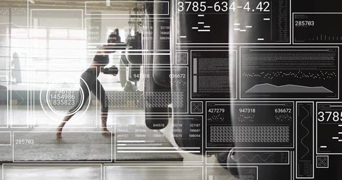 Female boxer training on heavy bag with futuristic hud data overlay in bright gym