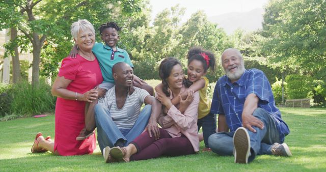 Happy Multi-Generational Family Relaxing Outdoors in Park - Download Free Stock Images Pikwizard.com