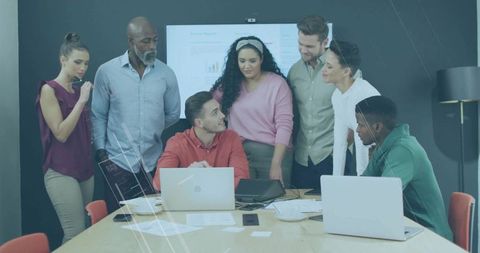 Diverse team brainstorming around office meeting table