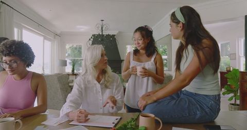 Women Relaxing and Enjoying Conversation in Cozy Home