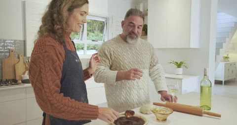 Couple Cozily Baking Together in Modern Home Kitchen