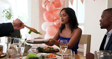 Diverse Group Enjoying Wedding Celebration Meal